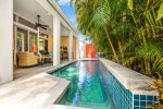 Heated pool and lush tropical back yard